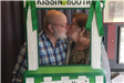 Couple Kissing in the Kissing Booth