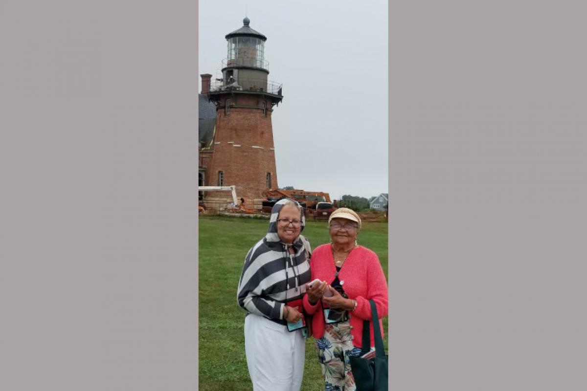 Women Posing with Lighthouse